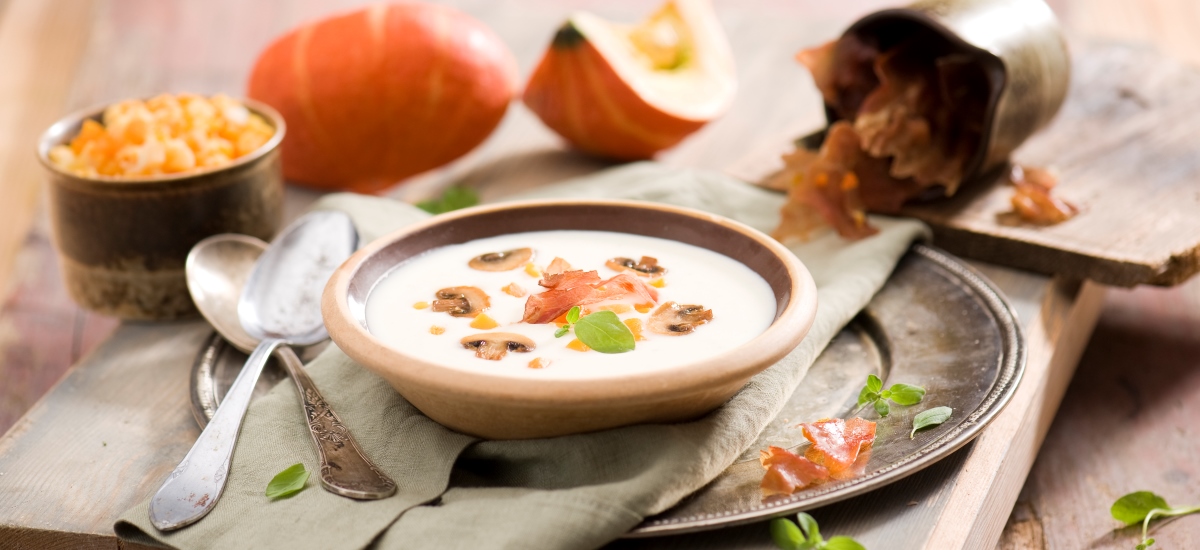 Cauliflower cream soup with baked pumpkin and dried ham